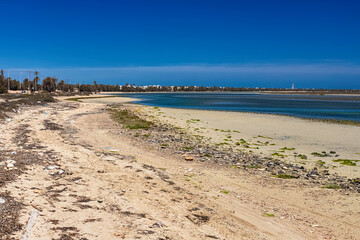 Beautiful view of the bay of the Mediterranean Sea at low tide on the island of Djerba, Tunisia