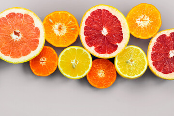 Sliced citrus on a white background. Grapefruit, lemon, tangerine.