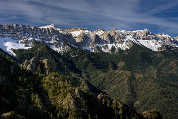 North face of the snowy Serra de Cadí seen from the path that goes up from the Bastanist Sanctuary to the Prat d'Aguiló refuge (Cerdanya, Catalonia, Spain, Pyrenees)