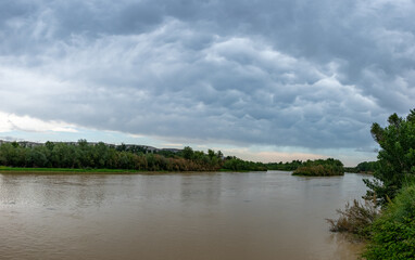 Fototapeta na wymiar panoramic clouds over the river