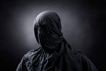Fototapeta na wymiar Creepy figure over dark misty background