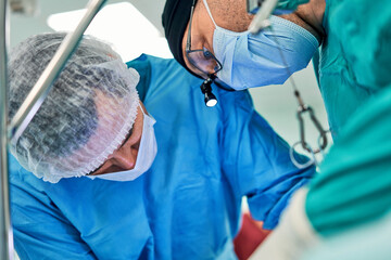 surgeon is working hard in the operating room