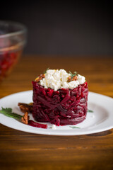 dietary salad of boiled beets with walnuts and cottage cheese