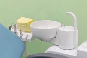 Professional equipment tools - spittoon, valve body, hygiene patient instrument in dental clinic for treatment and hygiene of teeth.