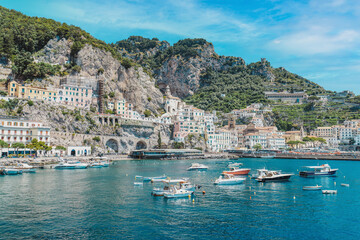 Amalfi coast is most popular travel and holiday destination in Europe.  Village with tiny beach and colorful houses located on rock. Italian summer paradise. Mountains on Amalfitana coastline. 