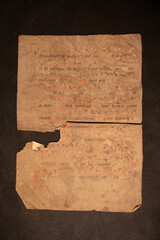 Manuscript fragment from a leaf written in medieval times on vellum or parchment. These fragments and leaves are taken from the bindings of books and were used as waste pieces. 