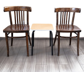 A real wooden Viennese chair on a light pine field against a isolated white background