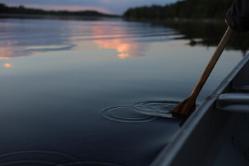 Oar in Lake Making Reflection with Clouds Reflected in the Background