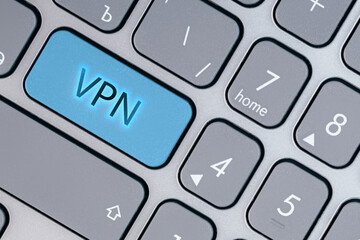 Word VPN is on the blue keyboard key. Networks and IT concept. Сoncept of private network security.