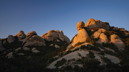 Sunset in the Montserrat mountains, seen from the path to the Sant Jeroni summit (Barcelona province, Catalonia, Spain)