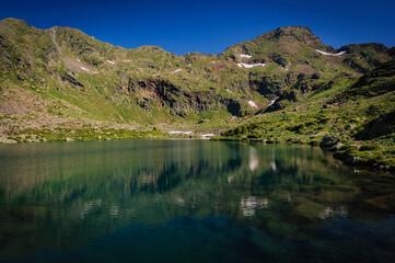 Tristaina peak and lakes, in summer (Andorra, Pyrenees)