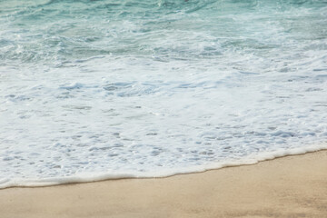 Fototapeta na wymiar Sandy yellow-white picturesque sea beach, summer background