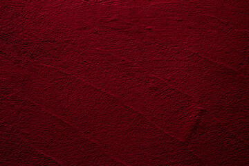 Crimson colored wall background with textures of different shades of crimson red