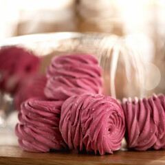Pink Marshmallow, close up. Rose shaped dessert on blurred sunny background. Homemade Sweets for loved one or holiday event. Soft focus.