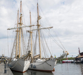 Fototapeta na wymiar Training sail ships HMS Falken and HMS Gladan in the harbor of Stockholm a spring day