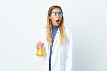 Young scientific woman isolated on white background looking up and with surprised expression