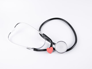 An images of a stethoscope and wooden love isolated on a white background. Healthcare concept.