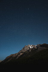 Obraz na płótnie Canvas Mountain peak with the dark blue starry night sky