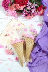 Still life with fruit ice cream and a bouquet of roses on a white background