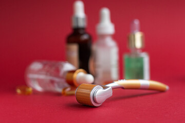 Dermaroller needle with serum in glass bottle. Anti wrinkle skin care. Derma roller and serum...
