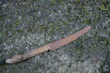 rusty knife on the ground