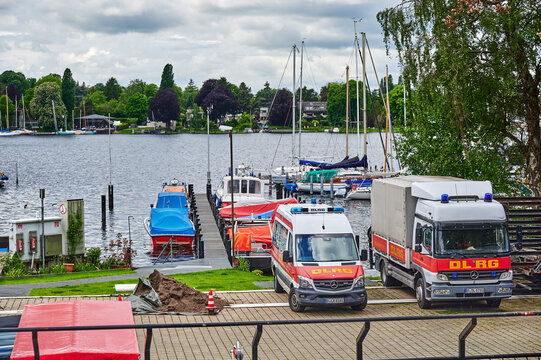 Berlin, Germany - May 27, 2021: Emergency vehicles of the German Life Rescue Society (DLRG) near the river Havel in Berlin.