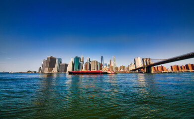 Industrial Ship Passing Downtown Manhattan on East River, New York