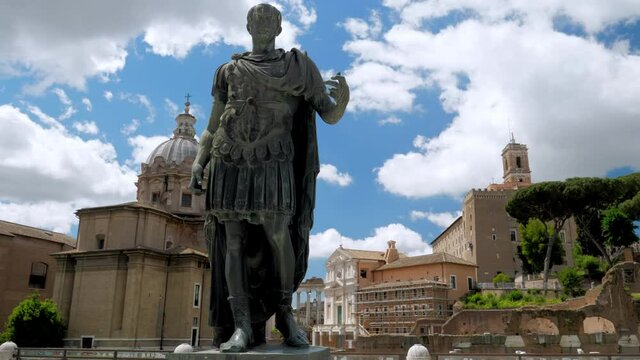 Bronze statue of emperor Julius Caesar along Via dei Fori Imperiali at the Roman Forum in Rome, Italy