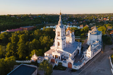 Aerial view of old monastery for men in Russia, Perm city in summer sunny day with golden dome