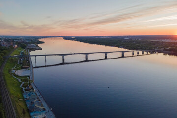 Aerial view of Perm and historical building, Kama river with bridge in sunny summer day with green trees in the sunset