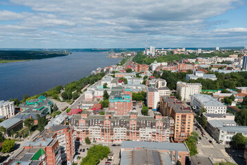 Fototapeta na wymiar Aerial view of Perm and historical building of art gallery, Kama river with bridge in sunny summer day with green trees