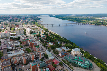 Aerial view of Perm and historical building of art gallery, Kama river with bridge in sunny summer...