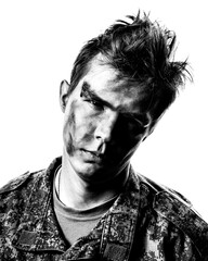 Black and white portrait of a young soldier in uniform and combat coloring with bruises and scars on a white background