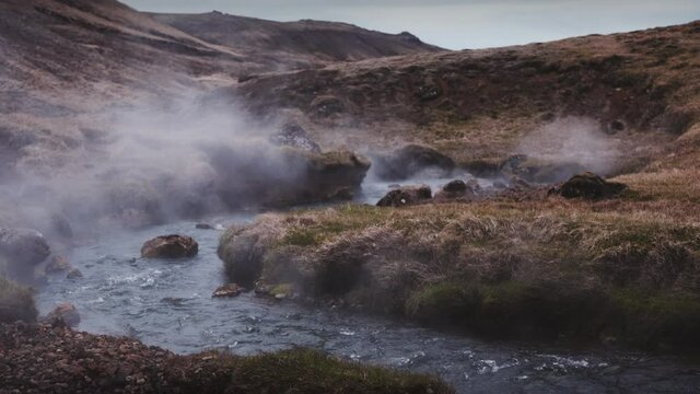 Gushing Clear Water on a River Releasing Steam 