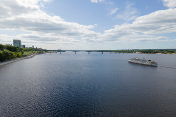 Obraz premium Aerial view of Perm and historical building of art gallery, Kama river with bridge in sunny summer day with green trees