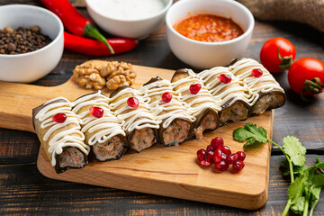 Eggplant rolls with cheese , nuts, herbs and pomegranate seeds. Dish of Georgian cuisine