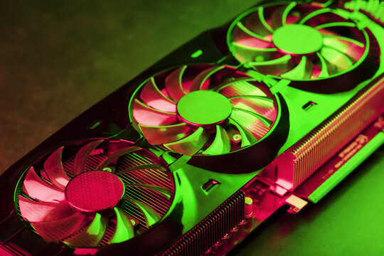 Coolers of the Gaming Video Card in red and green neon light.