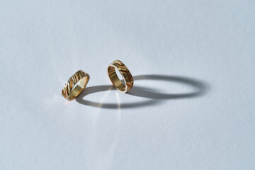 Pair of elegant shiny jewelry rings with embossing