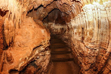 Narrow passage through a karst cave.