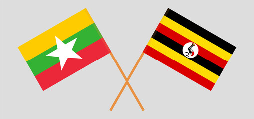 Crossed flags of Myanmar and Uganda. Official colors. Correct proportion