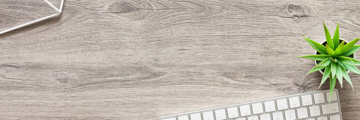 Wooden desk. Top view. Copy space. Home office. Decorative plants. Banner