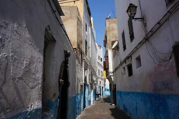 Narrow White-and-Blue painted Street in the Old Medina. Casablanca, Kingdom of Morocco.