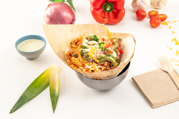 Mexican arepa with shredded chicken meat, guacamole, various cheeses, pico d gallo and parsley