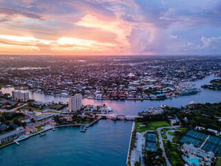 aerial drone of Lighthouse Point Florida with sunset and city