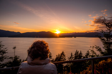 person watching the sunset over Bowen Island and Howe Sound