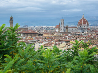 Fototapeta na wymiar Cityscape of Florence old city seen from piazzale Michelangelo - Santa Maria del Fiore cathedral, Palazzo Veccio, cloudy day, Italy