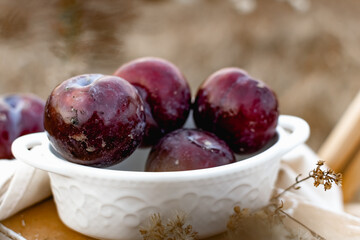 plums in a bowl