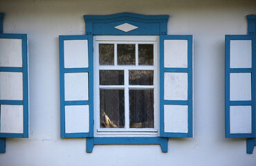 Old window on a wooden wall. Architecture.