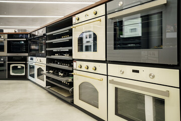 Fototapeta premium Electrical ovens, home appliances in the store..