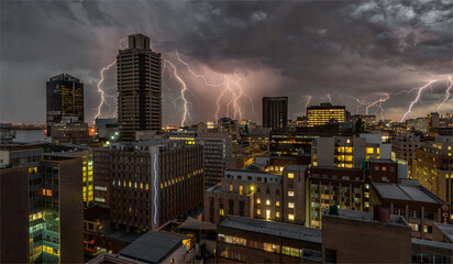 Naklejka premium lightning over the city at night